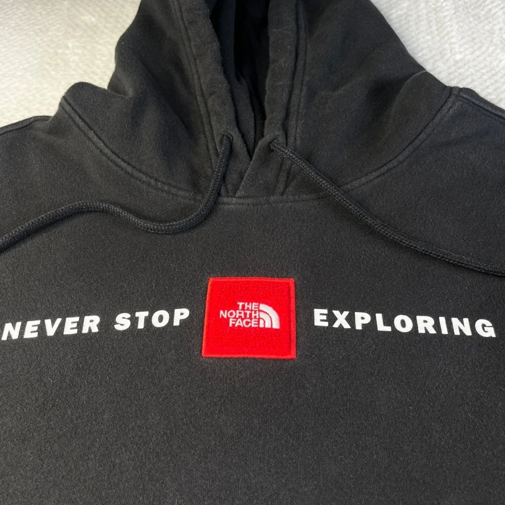The North Face Mens Never Stop Exploring Black Hoodie Red Logo Patch XL